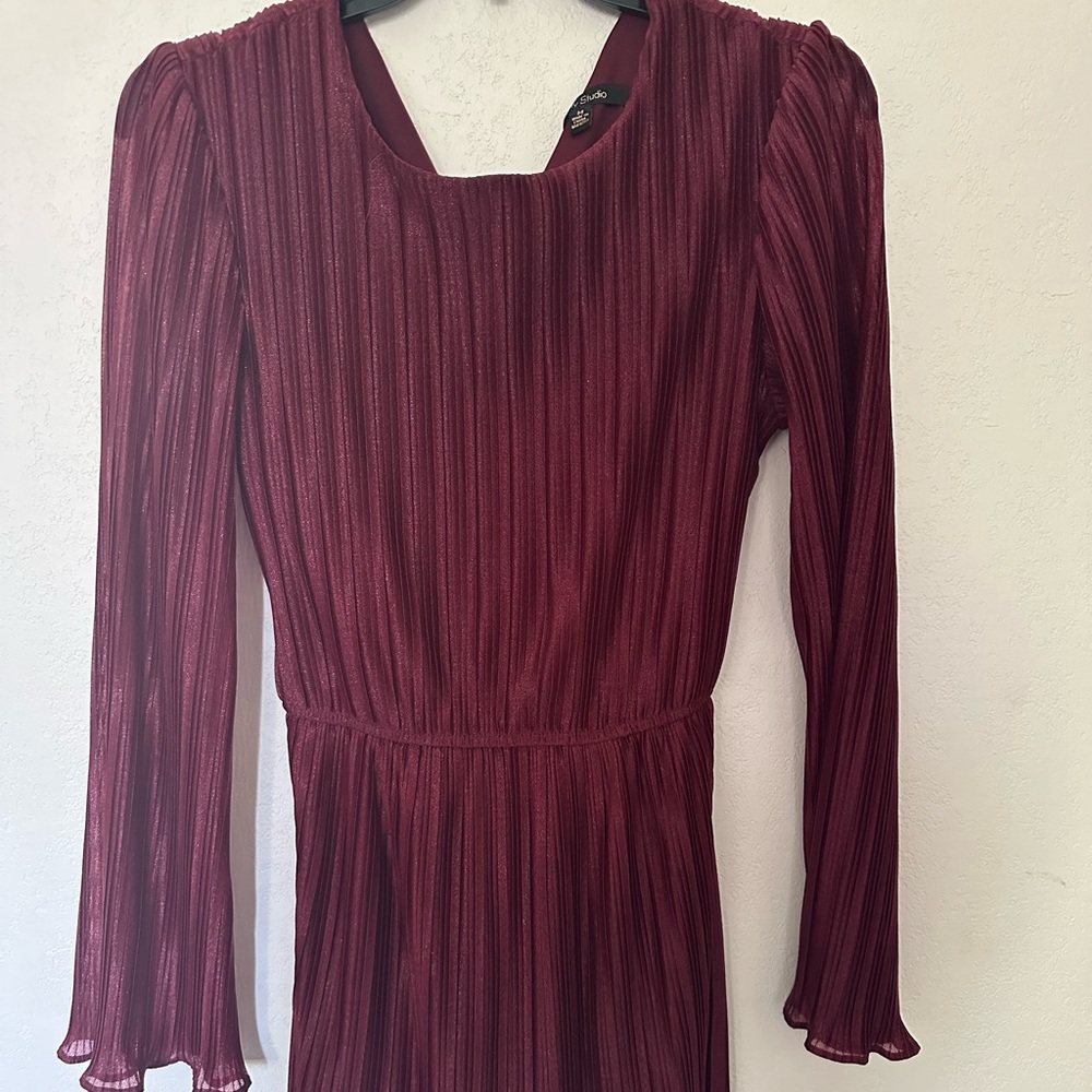 Red dress with sheer sleeves and ruffled sleeves and ends